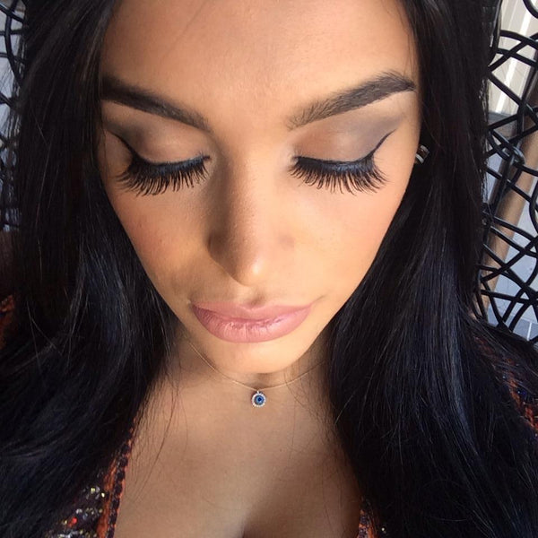 Close-up of Shooting Daggers Mink Lashes on dark eyes, showcasing length and volume